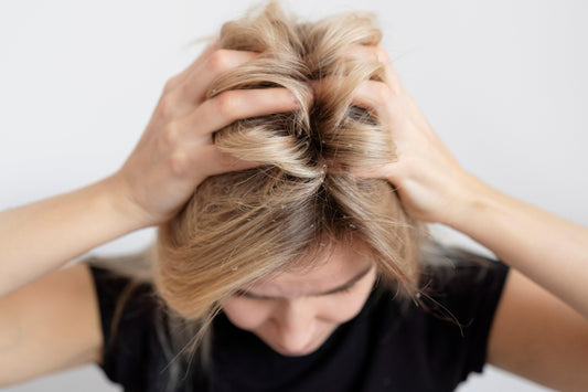 Woman putting hands in hair