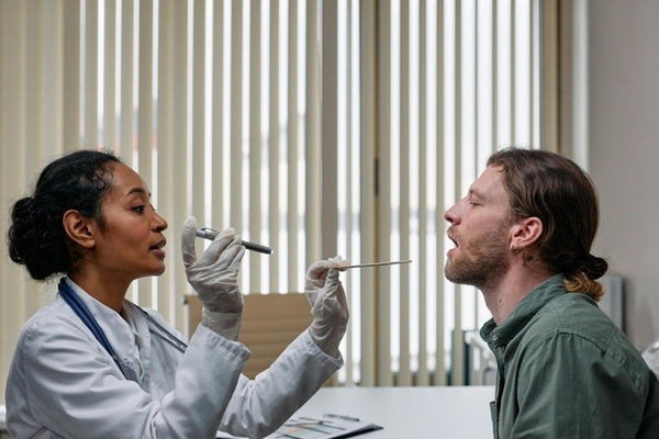Male having an examination by a female doctor