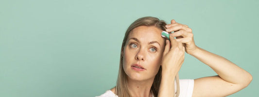 Woman using a derma roller