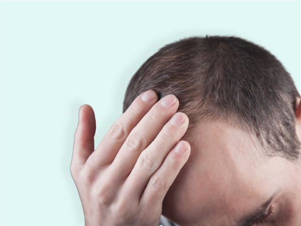 Woman checking on signs of hair loss