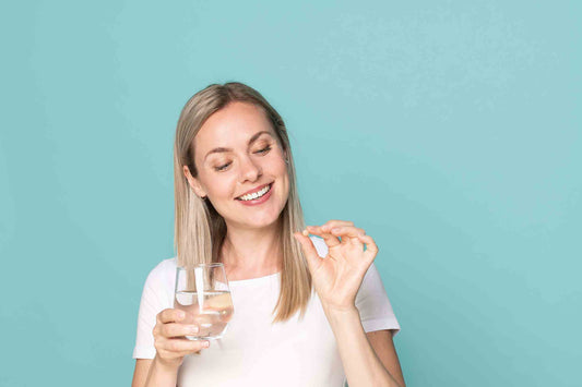 Woman that is taking her supplement to help her estrogen level