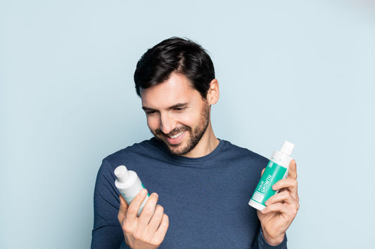 Man holding neofollics product