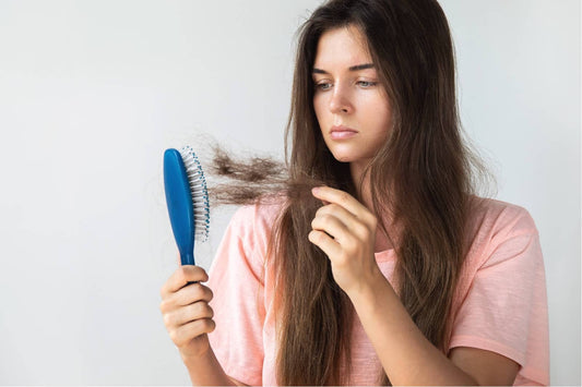 Woman looking at lost hair