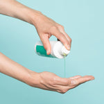 Neofollics hair growth stimulating shampoo pouring on hand