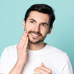 Man applying neofollics beard growth stimulating serum