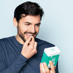 Man taking Neofollics anti grey hair tablets