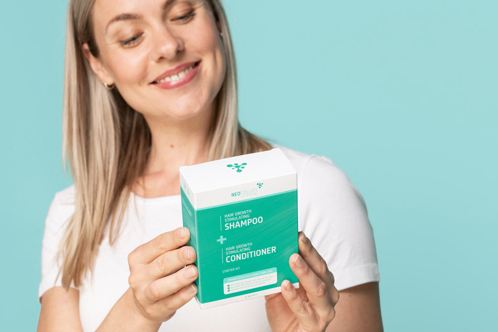 Woman looking at Neofollics Hair Growth Starter kit